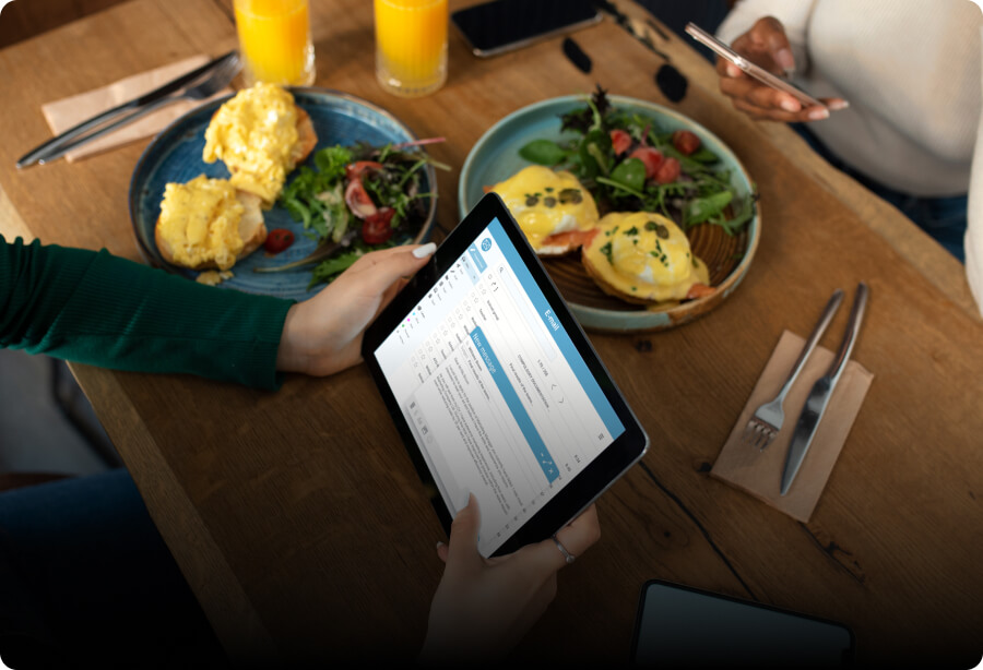 Customer ordering in a coffee shop using an order-taking tablet